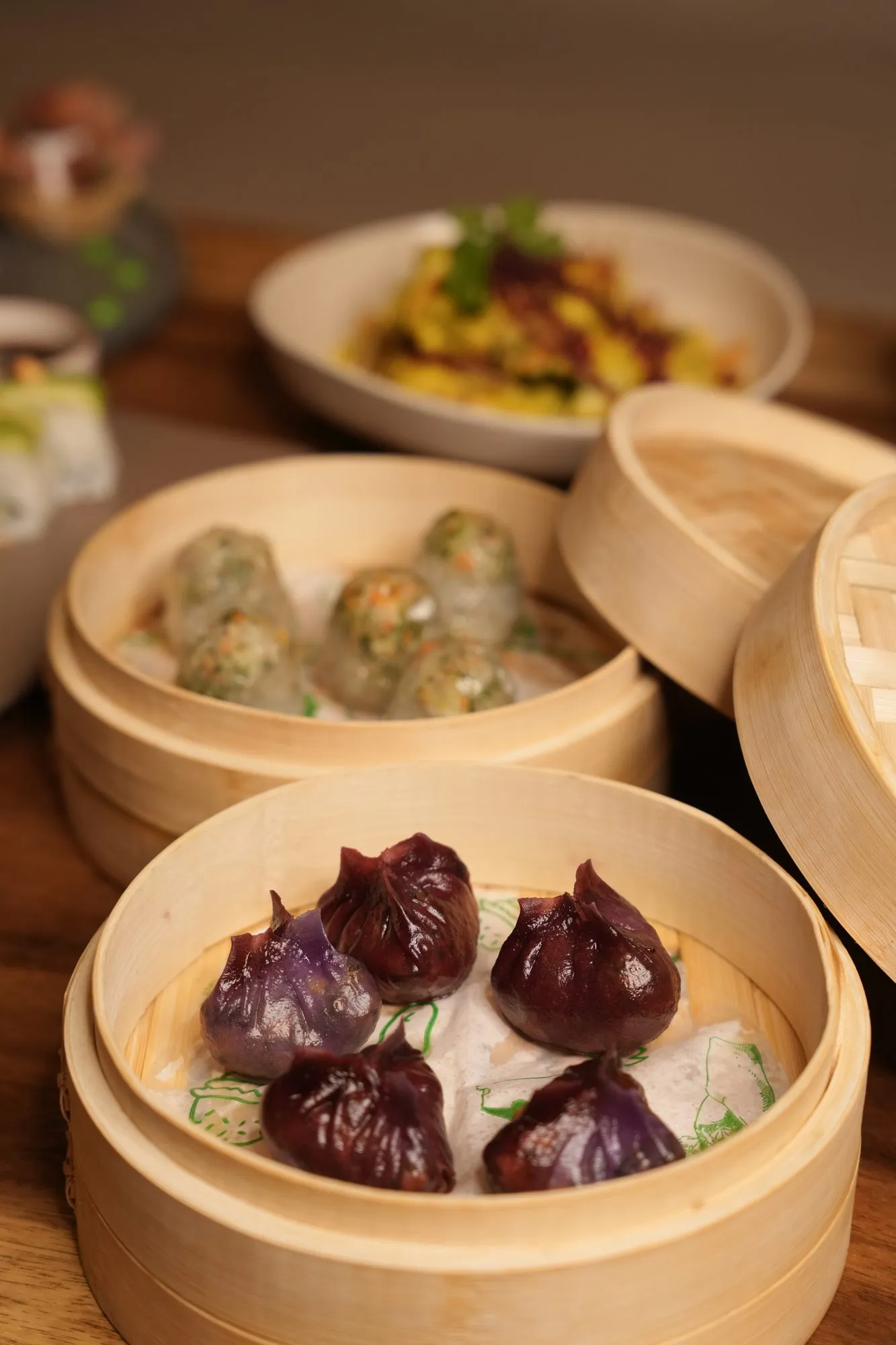 Steamed dumplings in two bamboo baskets